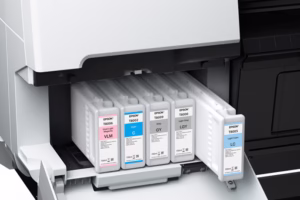 Archival ink cartridges from Epson in a printer.